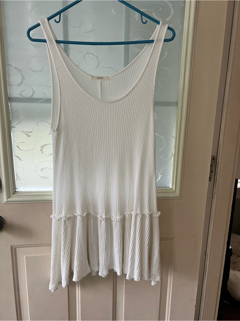 Easel size M sleeveless babydoll tank tunic dress in cream.
